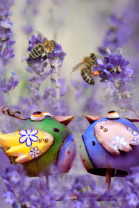 Garden Still Life with metal birds and bees on lavender Garden Still Life with metal birds and bees on lavender
